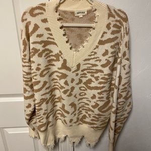 Animal print, v neck cozy sweater with shark bite hem. Only worn once.